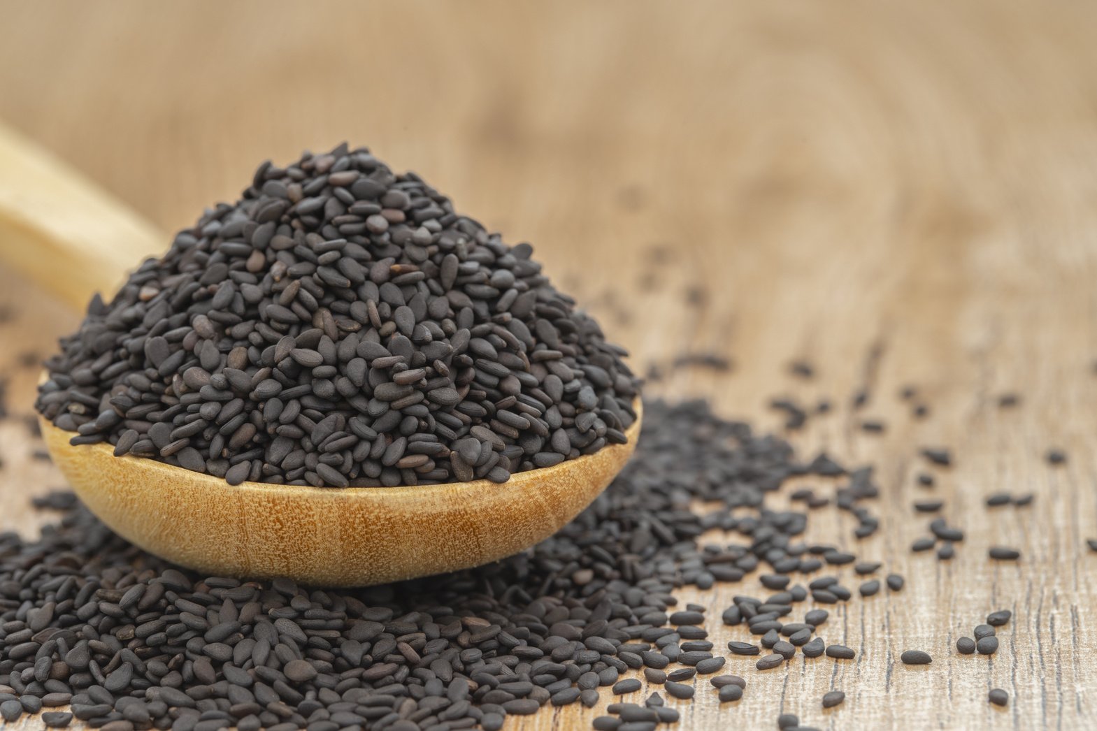 Wooden Bowl with Black Dried Sesame Seeds